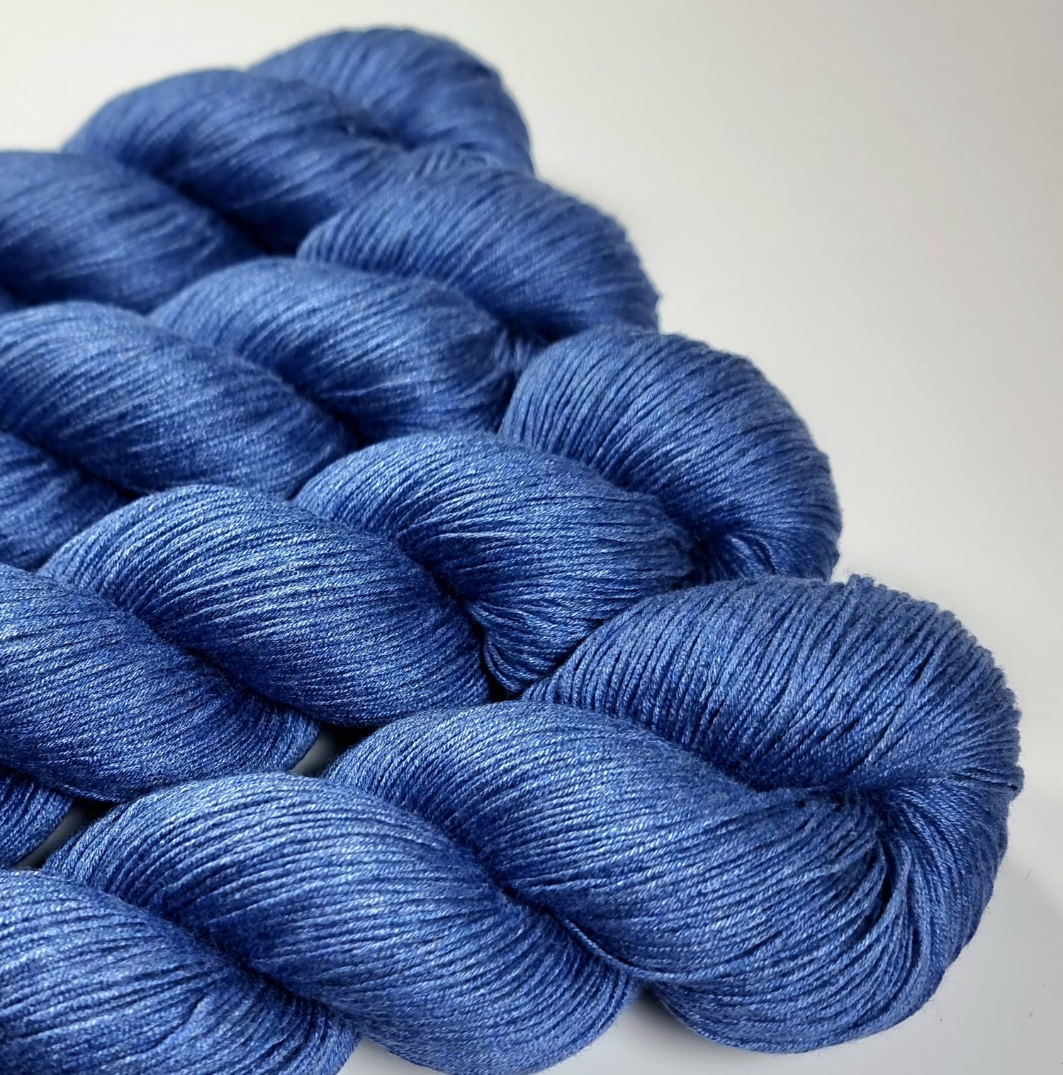 Blue yarn skein on a white background
