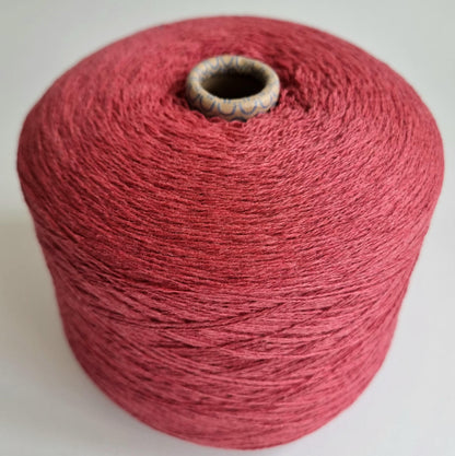 Red spool of yarn on a white background