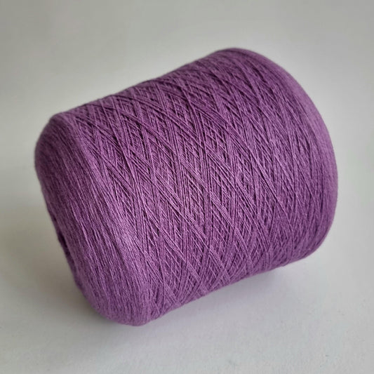 Purple skein of yarn on a light gray background
